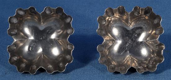 A pair of Victorian silver sweetmeat moulds,